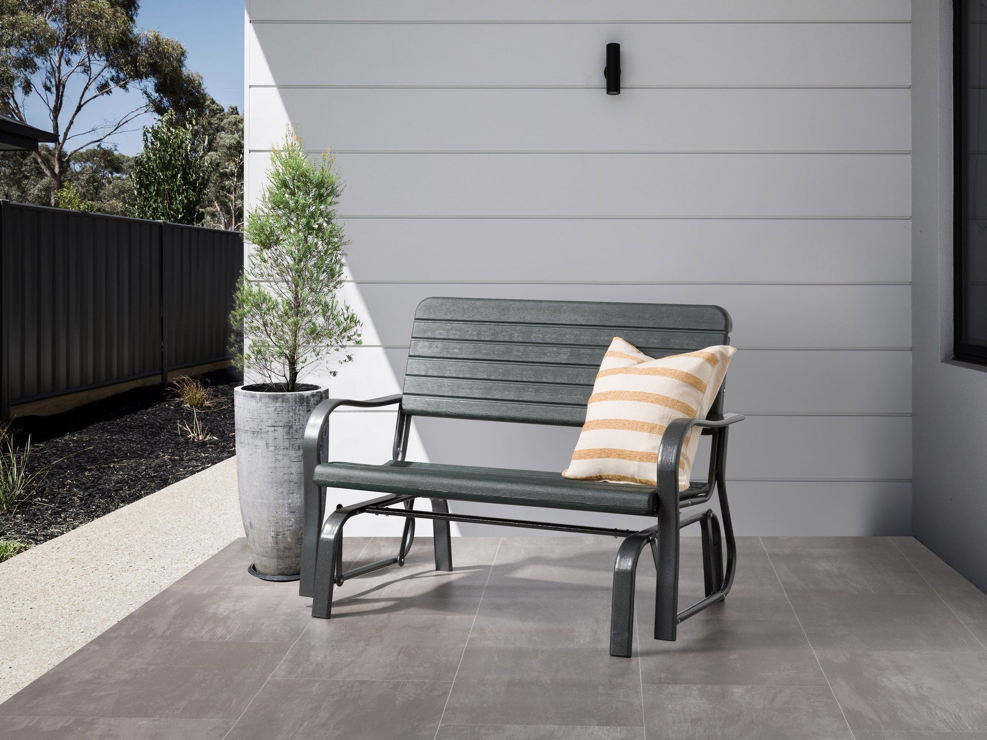 dark green Gliding Bench Lake Front Collection lifestyle scene by CorLiving#color_dark-green