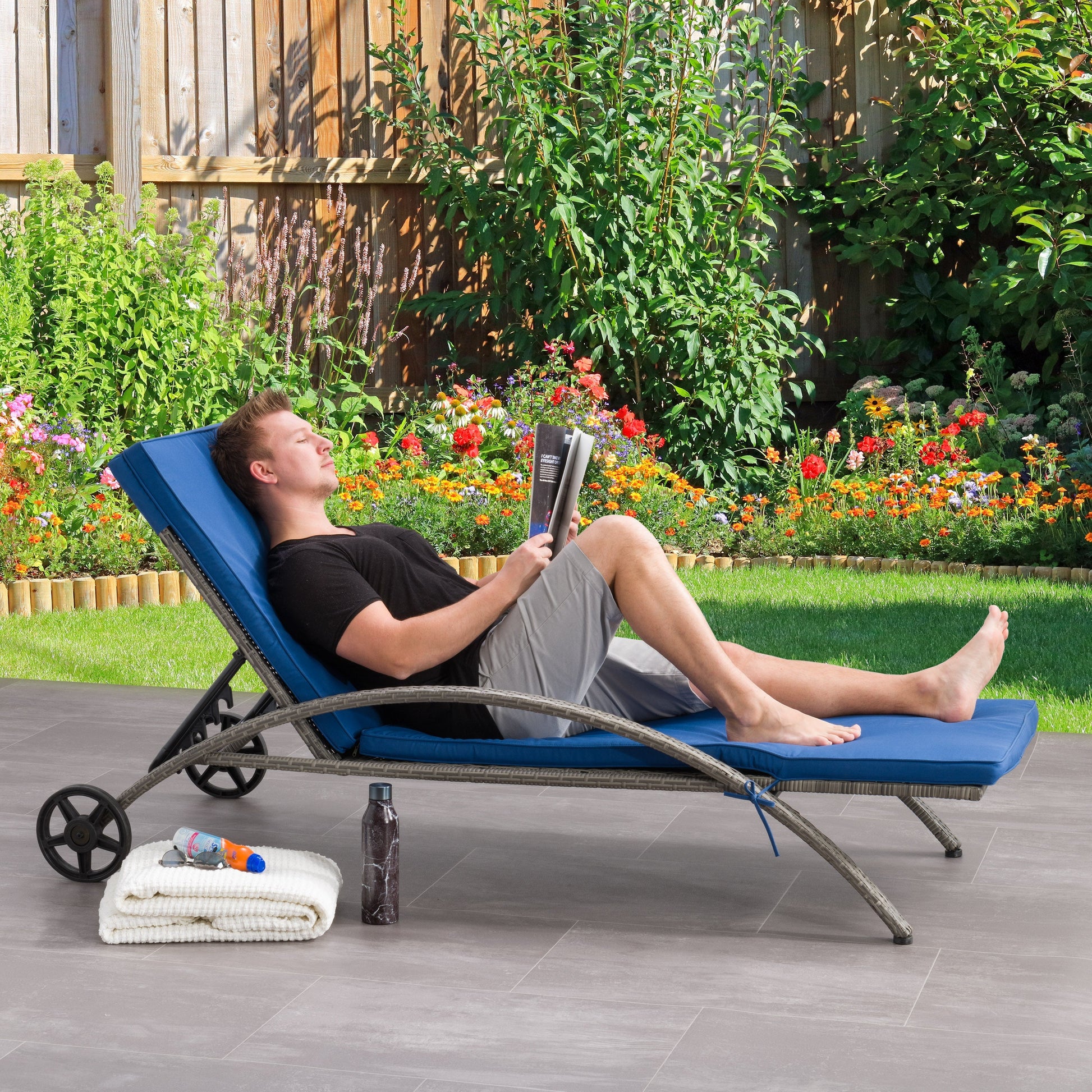 blended grey and oxford blue Outdoor Wicker Lounge Chair Parksville Collection lifestyle scene by CorLiving#color_blended-grey-and-oxford-blue